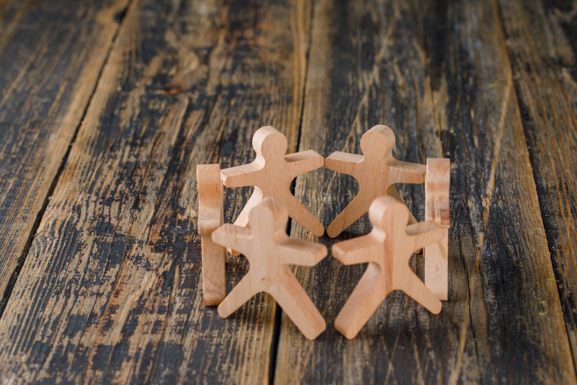 Business Success Teamwork Concept With Wooden Figures People Wooden Table Top View